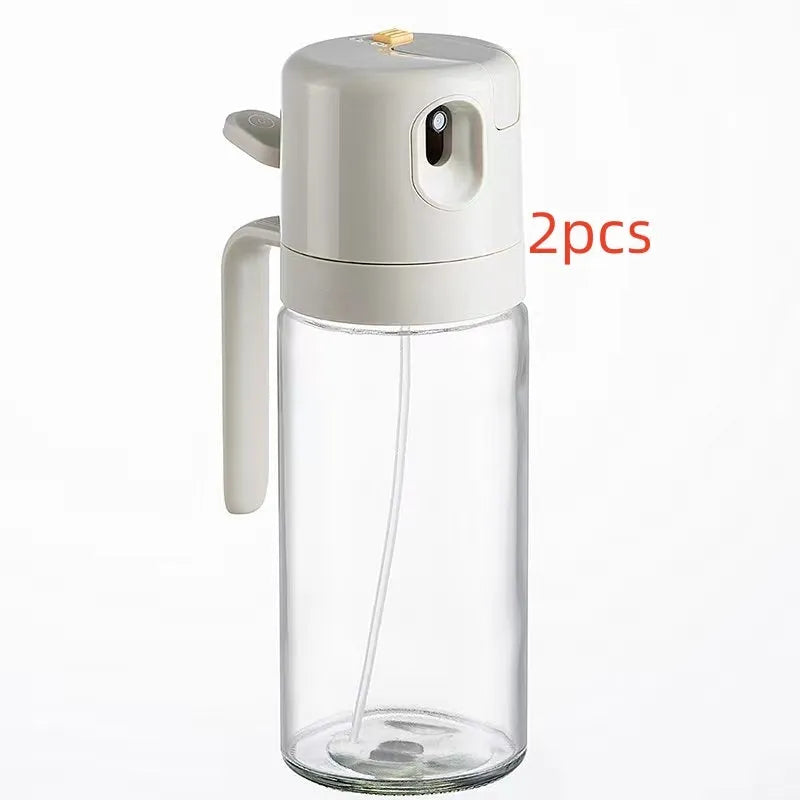 Warm grey 550ml glass oil sprayer bottle with switchable spray/pour cap on kitchen counter