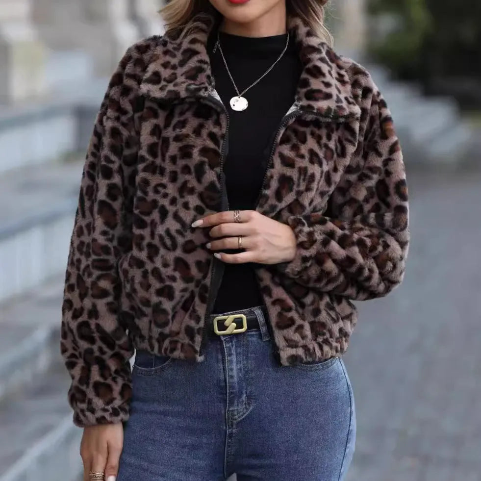 Women's loose long sleeve leopard print zip coat with raglan sleeves on a hanger.