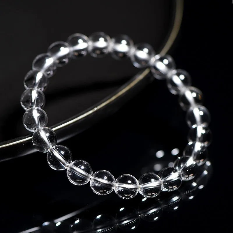 Natural Donghai white crystal round bead bracelet with geometric single circle design on a wrist.