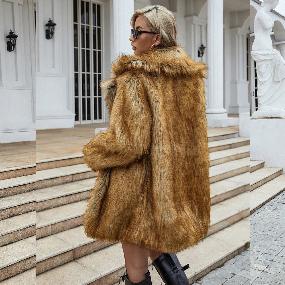 Yellow loose women's faux fur coat on a hanger, showing regular sleeves and textured fabric.