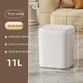 White smart induction trash can with automatic opening lid, shown in a kitchen setting.