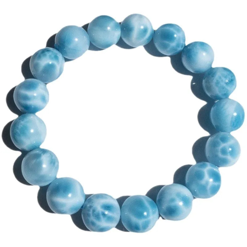 Blue handcrafted Bodhi bracelet with pearl accents, showing different bead size options.