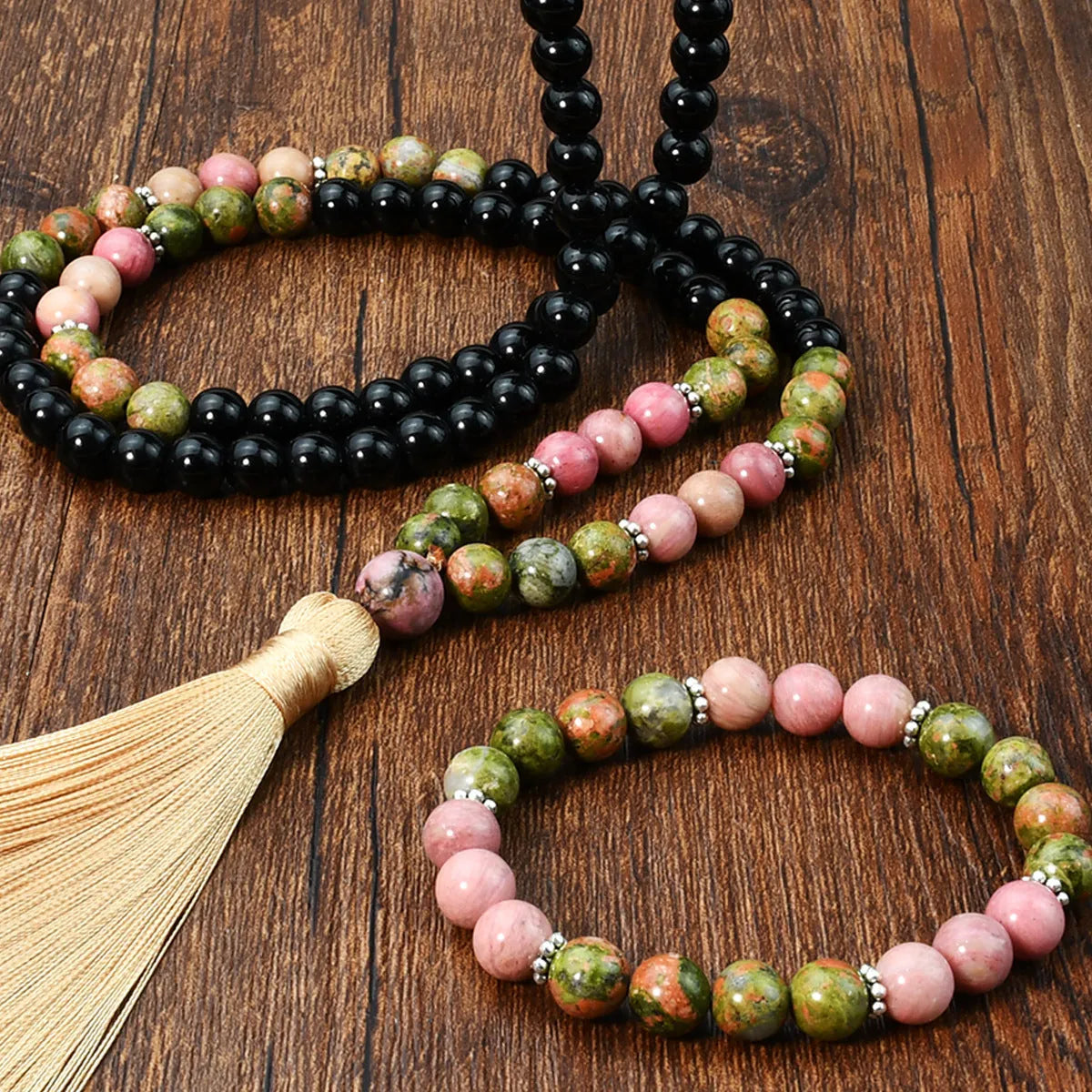 Natural unakite stone 108 prayer beads mala necklace and matching bracelet on neutral background