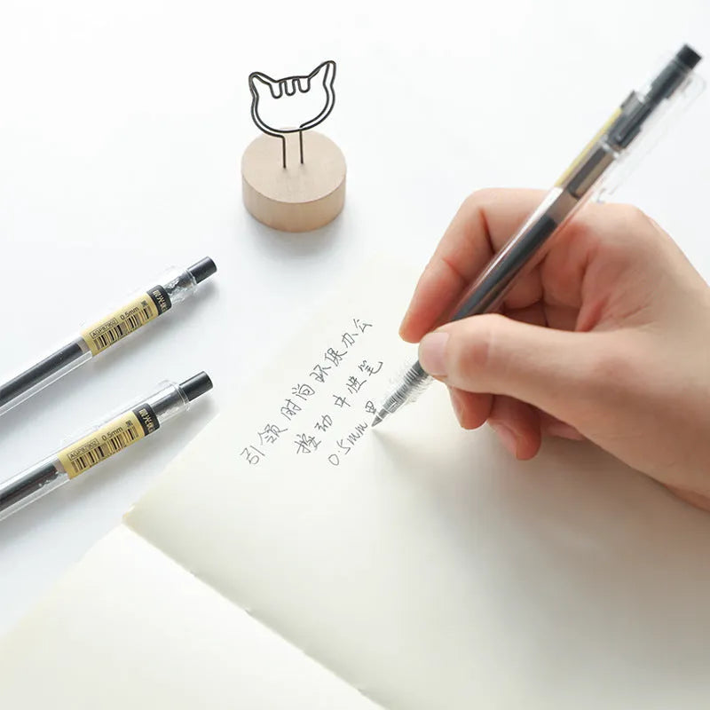 12 black retractable gel pens with frosted barrels and 0.5mm tips displayed with two spare refills