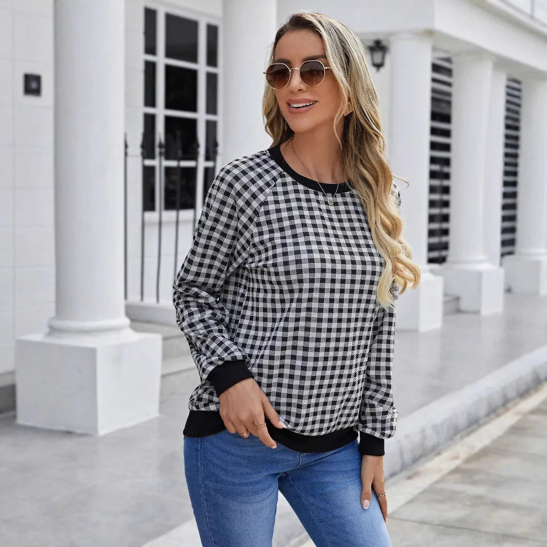 Black long sleeve polyester pullover sweater with a printed Japanese sweet plaid stripe pattern.