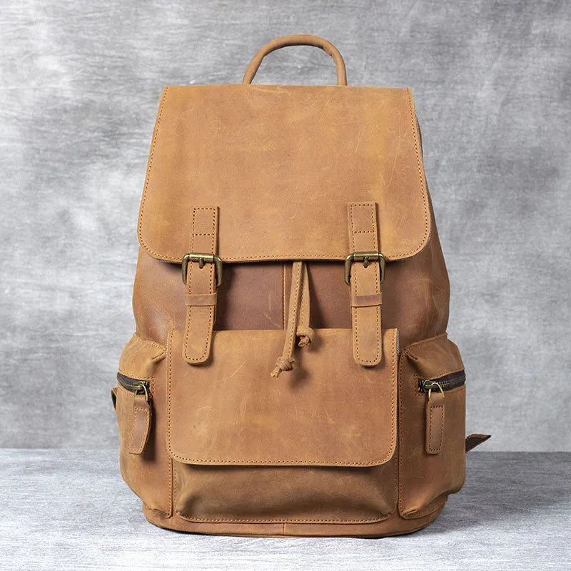 Brown retro-style leather backpack with shoulder straps, made from first layer cowhide with denim lining.