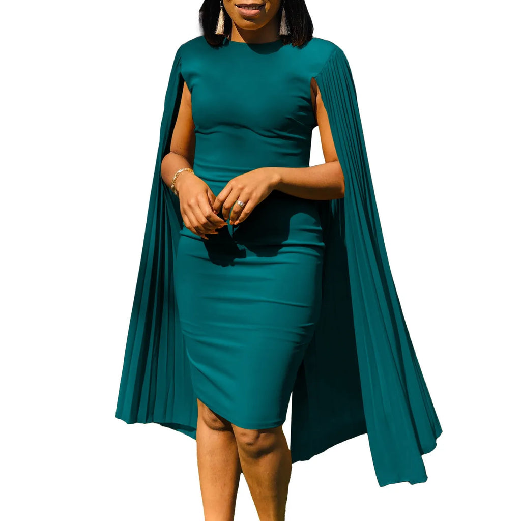 Yellow round neck long sleeve evening gown with high waist and pleated skirt on a model.