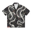 Original designer snake bone pattern printed on a short sleeve Cuban collar shirt in loose fit.