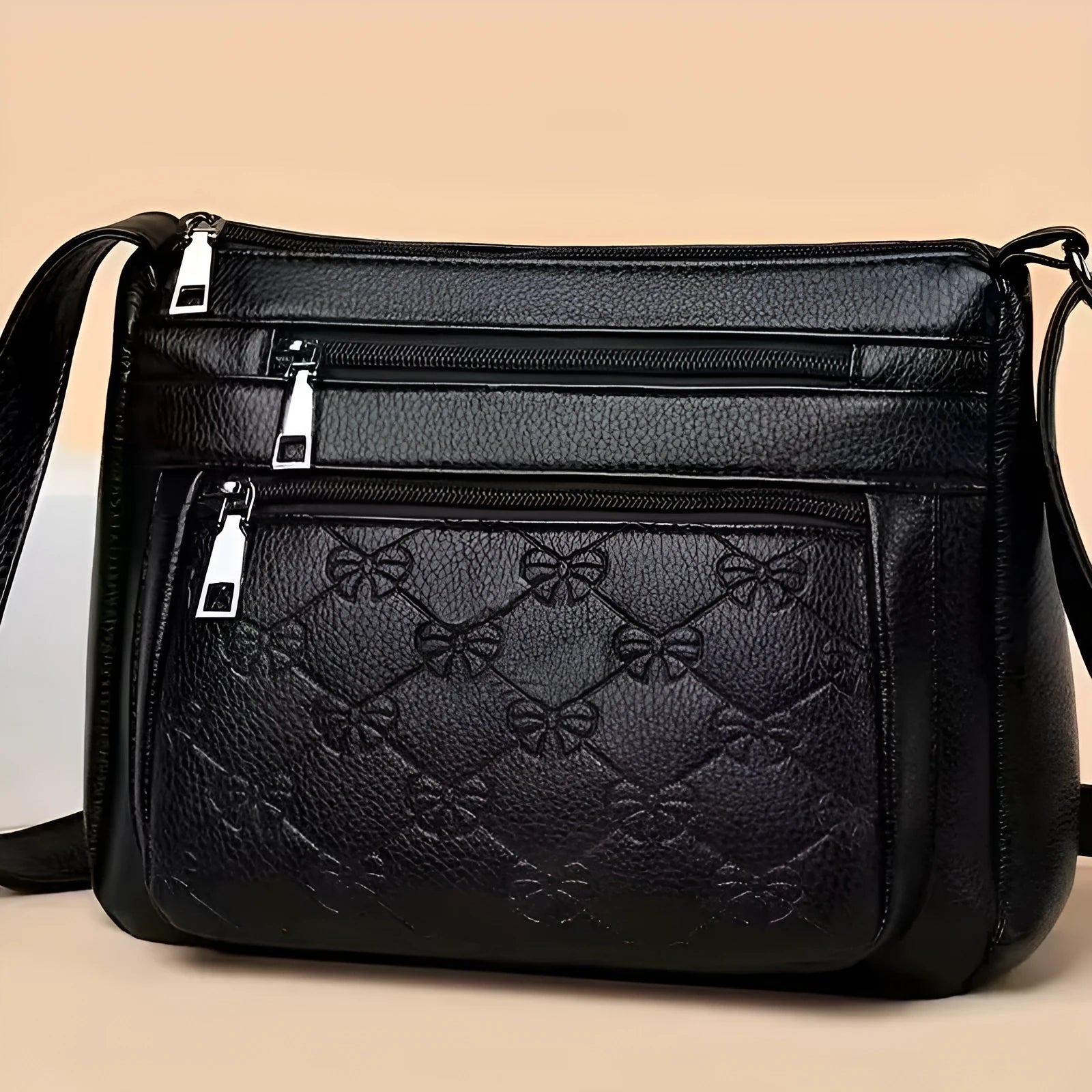 Butterfly black women's crossbody messenger bag with embossed detailing and horizontal square shape