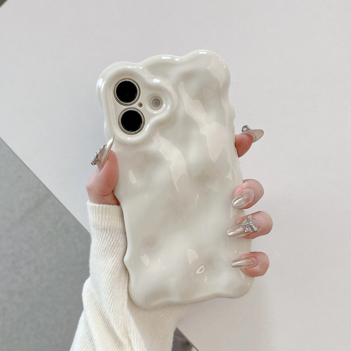 Electroplated TPU phone case for iPhone with wave bubble design, anti-fall and anti-fingerprint functions, shown in silver plating