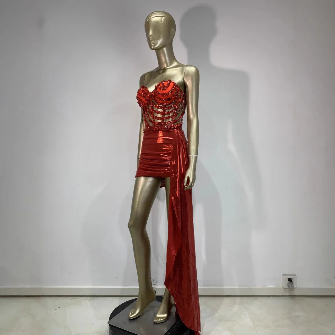 Red women's skirt suit with see-through mesh panels, a stage and party costume in stretch spandex.
