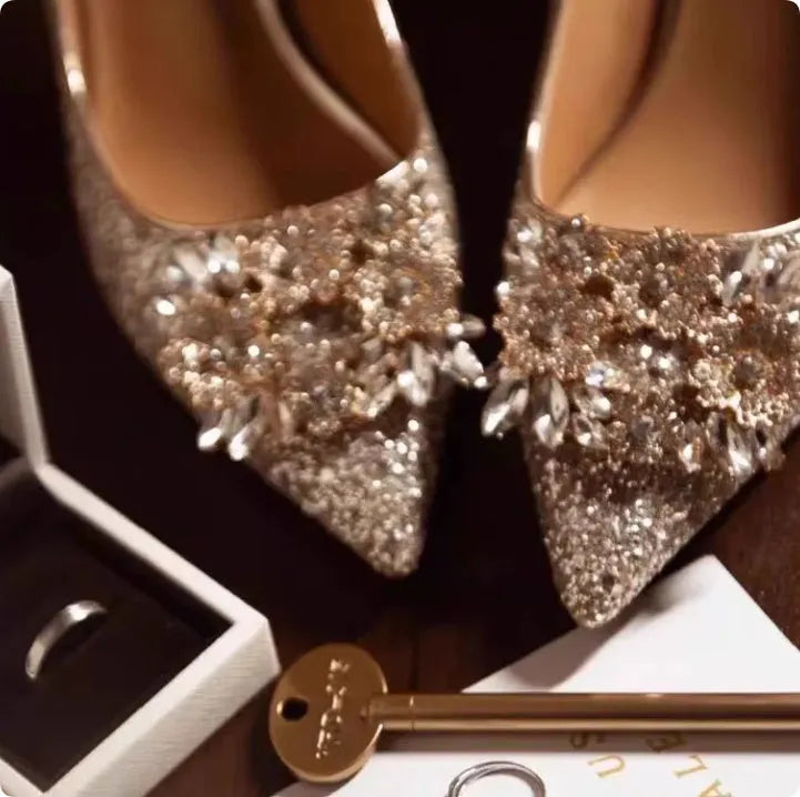 Champagne coloured pointed toe bridal shoes with rhinestone floral pattern on a fine heel.
