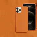 Genuine brown cowhide leather iPhone case with simple half line design on an iPhone 14 Pro Max.