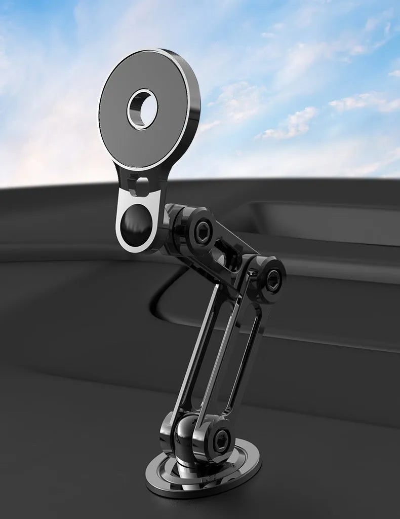 Black magnetic car phone holder mounted on dashboard with phone attached showing 360-degree rotation capability