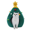 Red Christmas tree shaped plush cave bed for cats and small dogs on a wooden floor