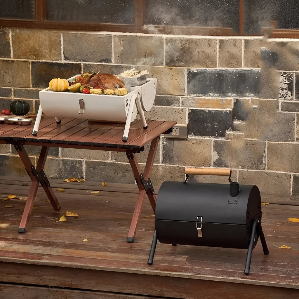 White round chimney oven style portable grill with folding carbon tank for frying and baking.