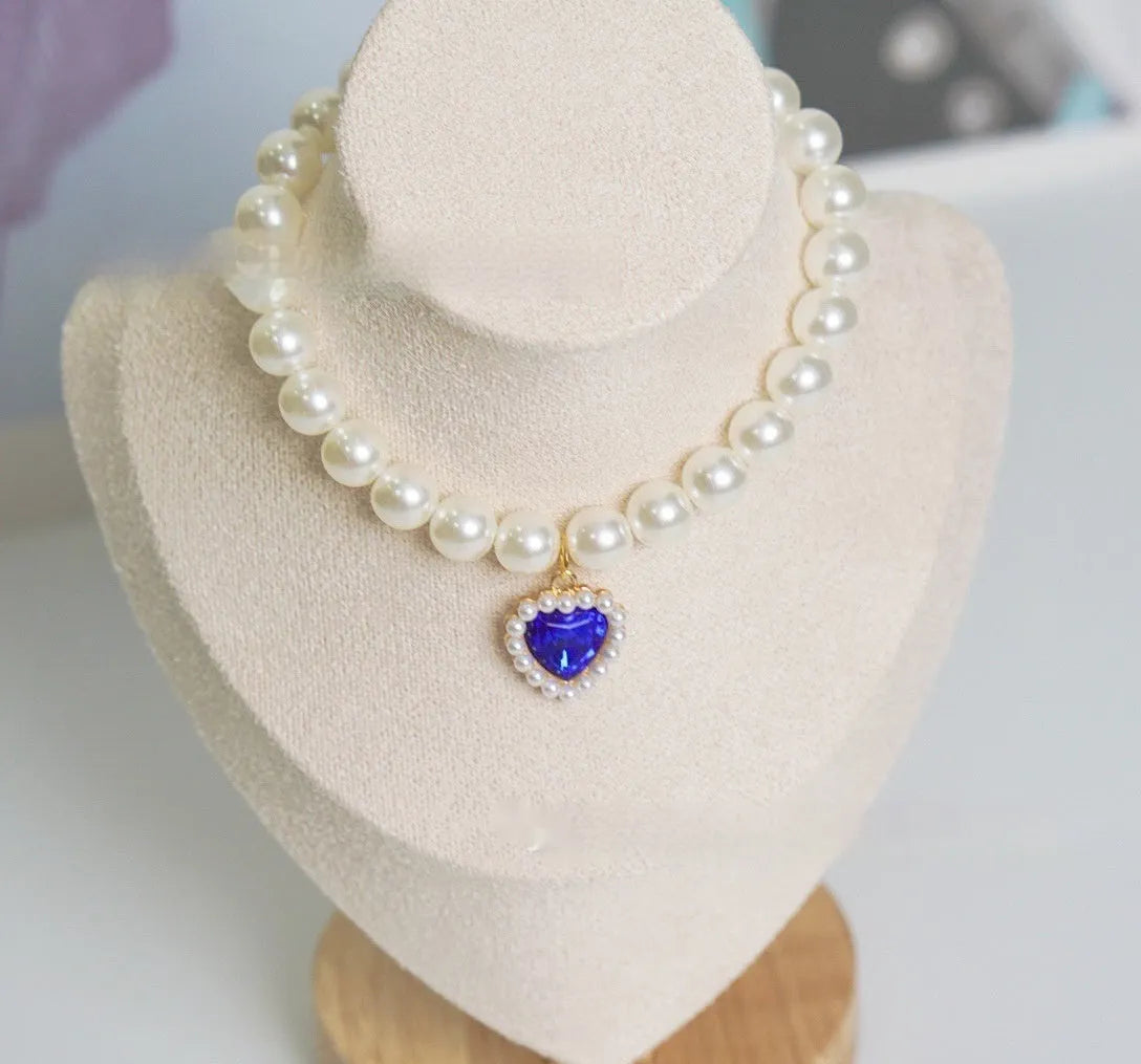 Decorative cat collar with plastic alloy resin construction and central gemstone charm in multiple colour options
