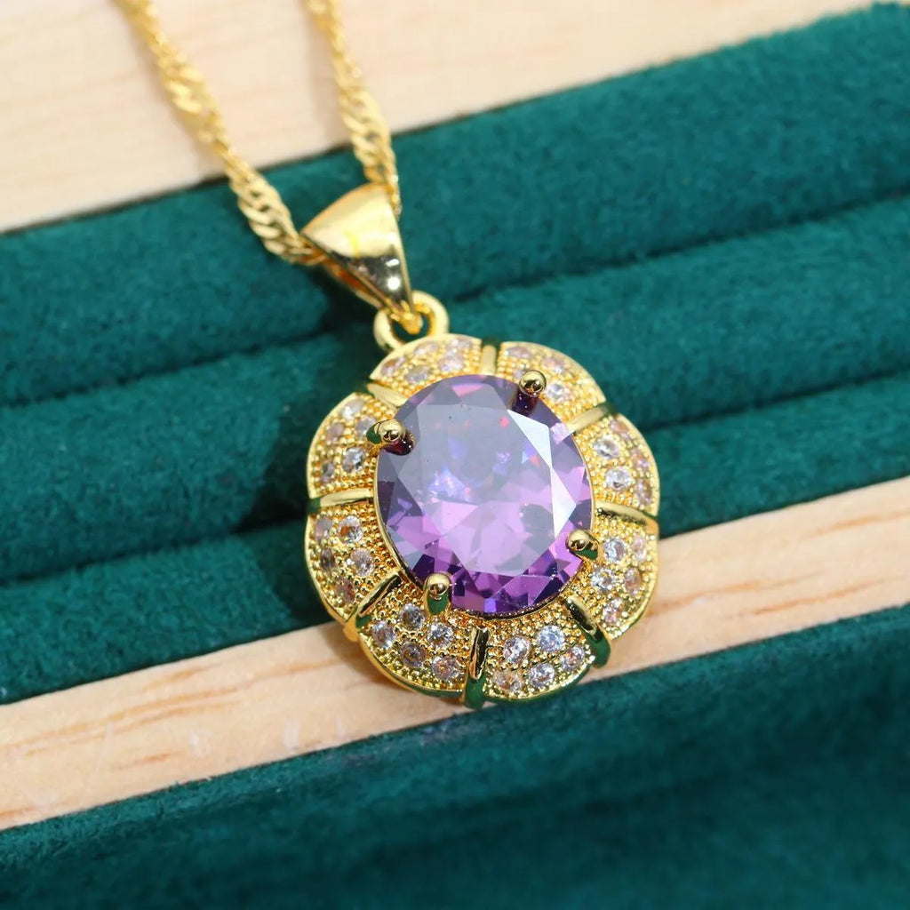Gold-coloured jewellery set with cubic zirconia stones showing necklace, earrings, ring, and bracelet.