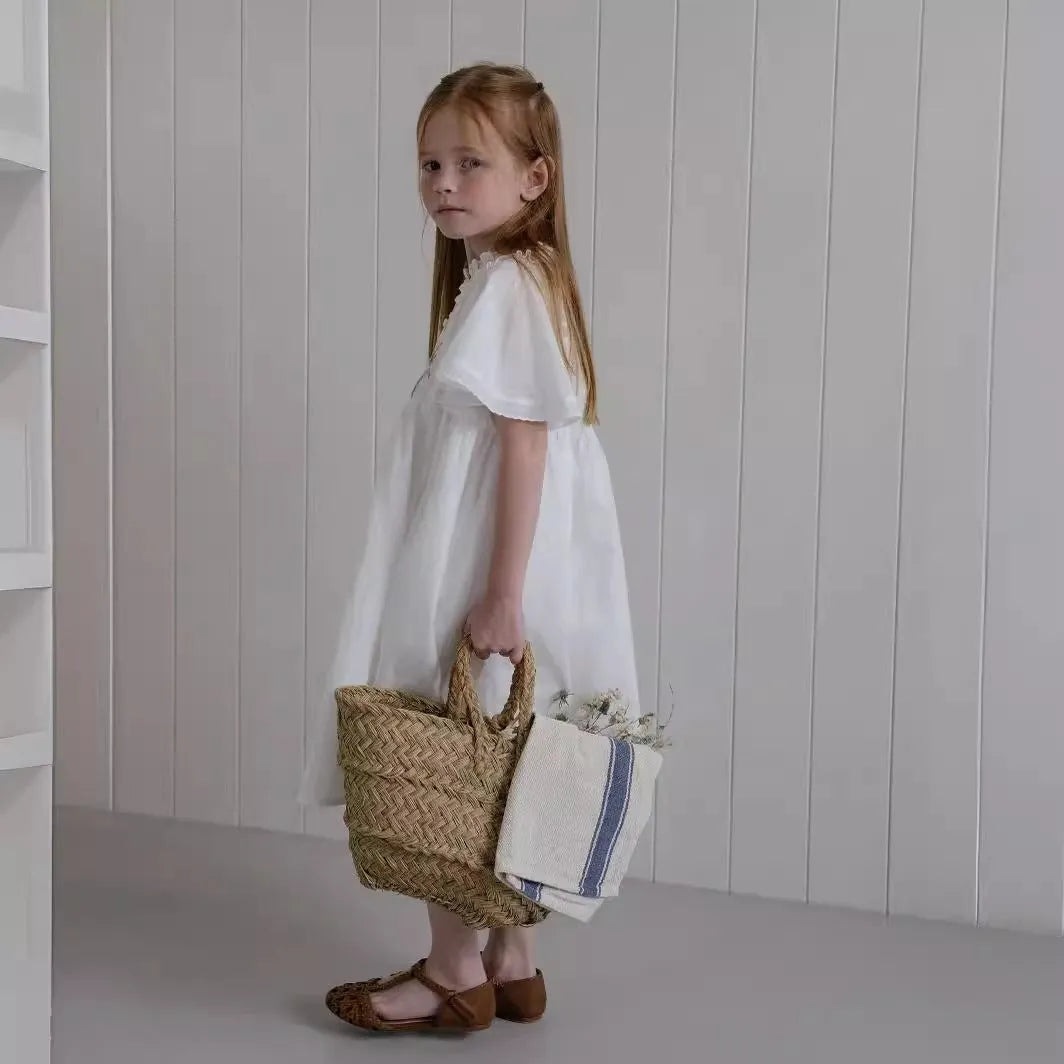 White cotton girls dress with embroidered ruffles, short sleeves, solid colour A-line shape