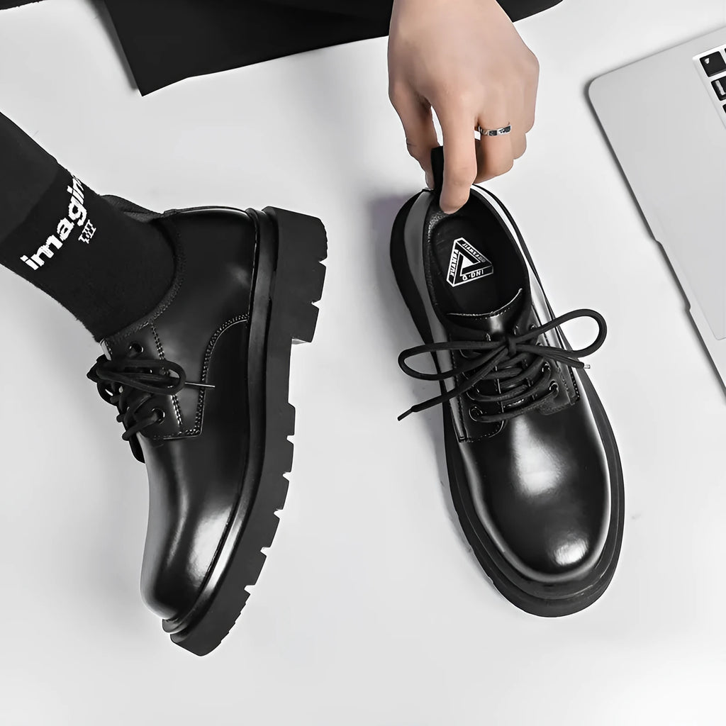 Men's black round-toe leather shoes with thick rubber sole and lace-up closure