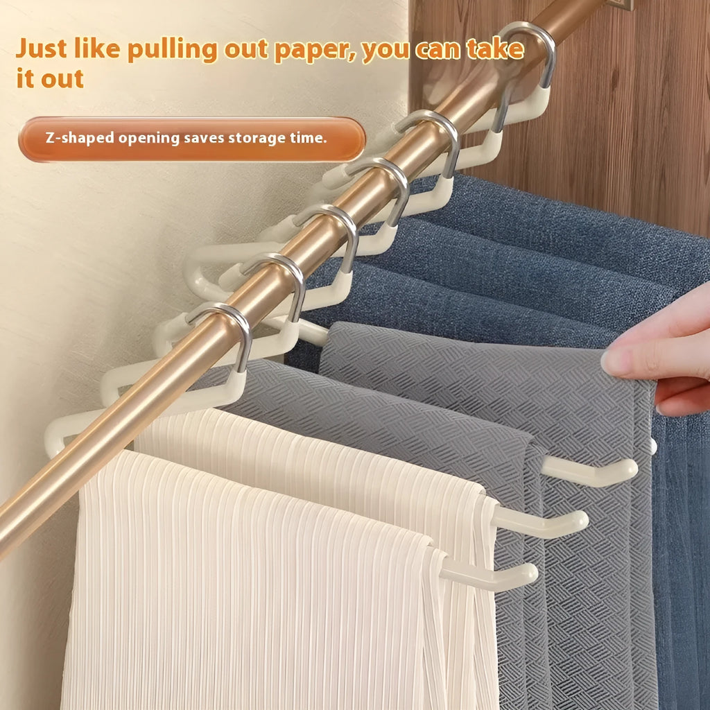 Non-slip Z-shaped trouser hanger in stainless steel dipped finish, shown in cream white, green and black