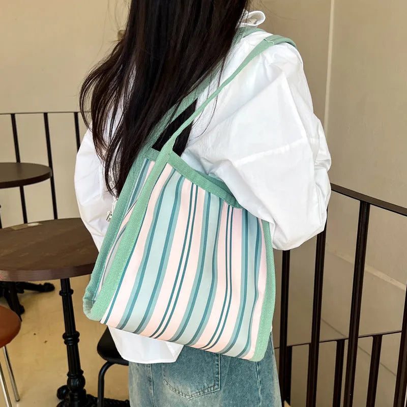 Women's large-capacity urban simplicity tote bag in blue, green, khaki, and pink with internal phone pocket and double shoulder straps