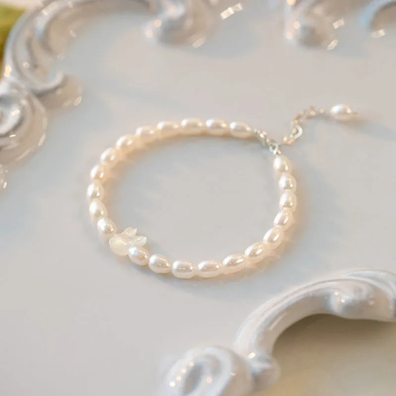 White shell pearl and 925 silver rabbit charm bracelet with elastic string