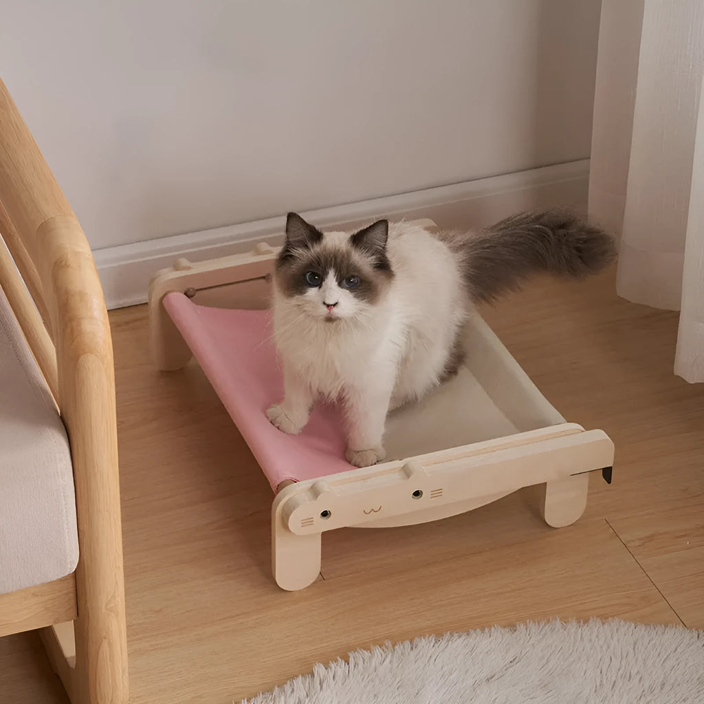 Solid wood pet bed for cats with a removable plaid cover