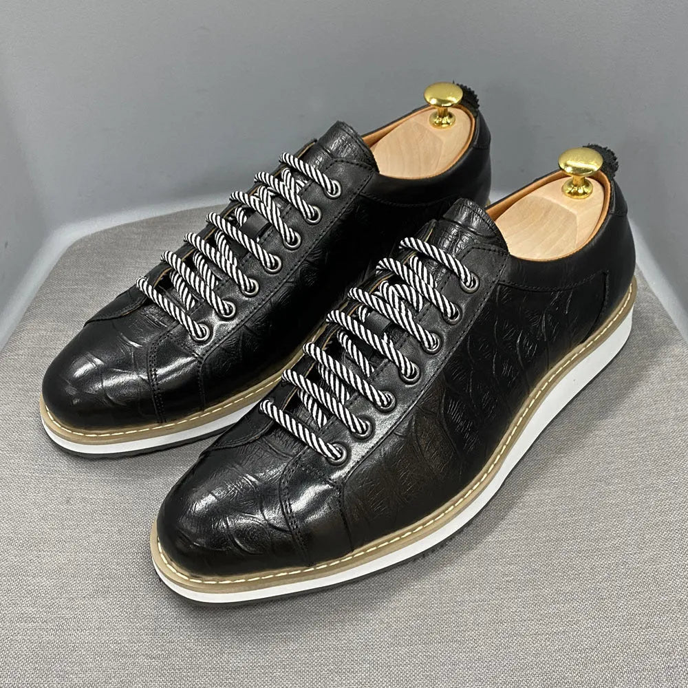 Men's low-top white shoes with embossed pattern texture, featuring lace-up front and microfiber lining.