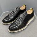Men's low-top white shoes with embossed pattern texture, featuring lace-up front and microfiber lining.