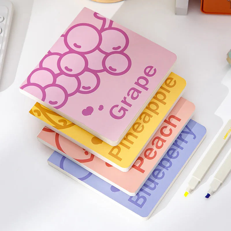 Square notebook with embossed fruit design on cover, showing 14.5cm size and open pages.