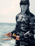Man wearing a grey long sleeve fishing shirt with an integrated hood and face mask, showing mesh side panels.