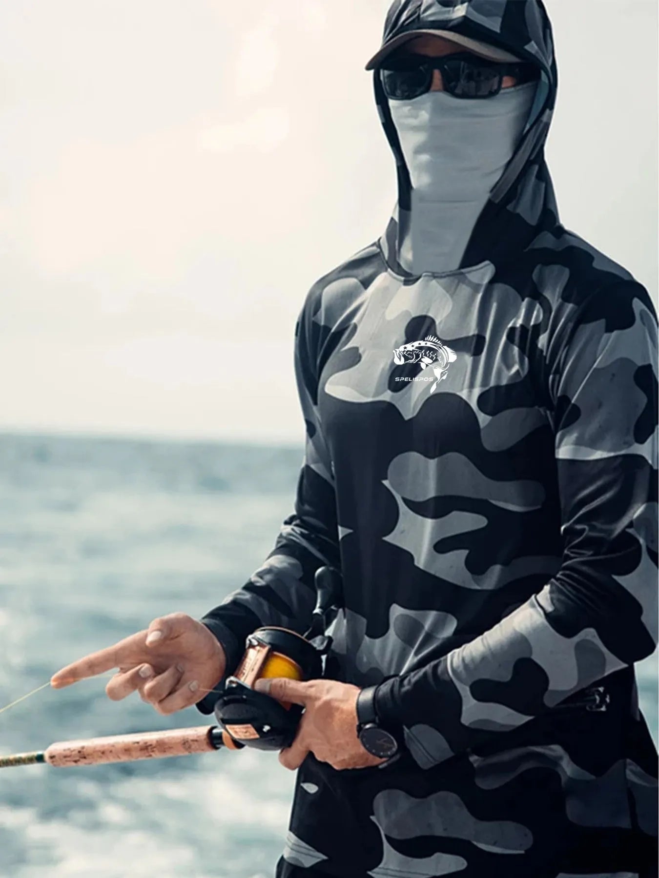 Man wearing a grey long sleeve fishing shirt with an integrated hood and face mask, showing mesh side panels.