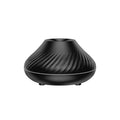 Beige volcanic flame aroma diffuser with LED lighting and mist output on wooden surface