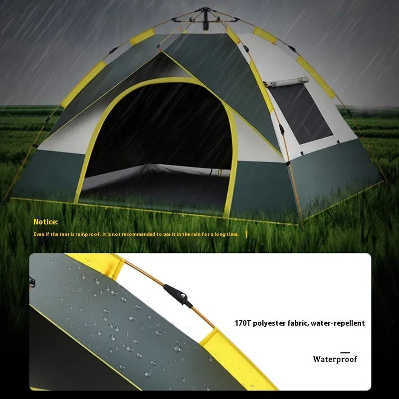 Dark green and silver automatic pop-up camping tent pitched outdoors.