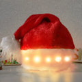 Red and white plush Santa hat with twinkling LED lights glowing in Christmas colours