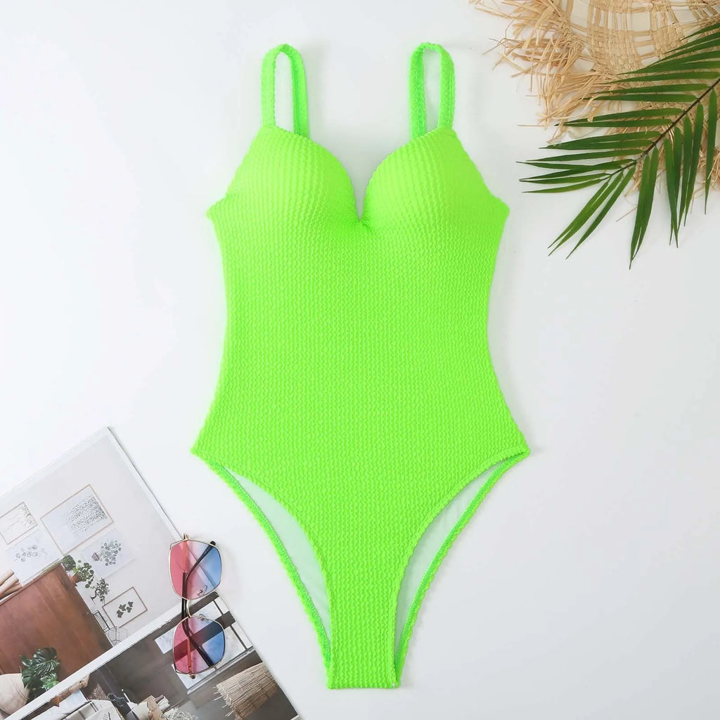 Women's sleeveless one-piece swimsuit with a small sunken stripe pattern in various colours.