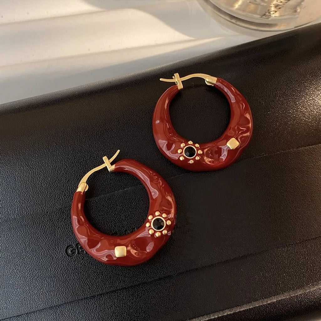 Hong Kong style retro stud earrings with dripping oil finish and rhinestone accents in black and red colours