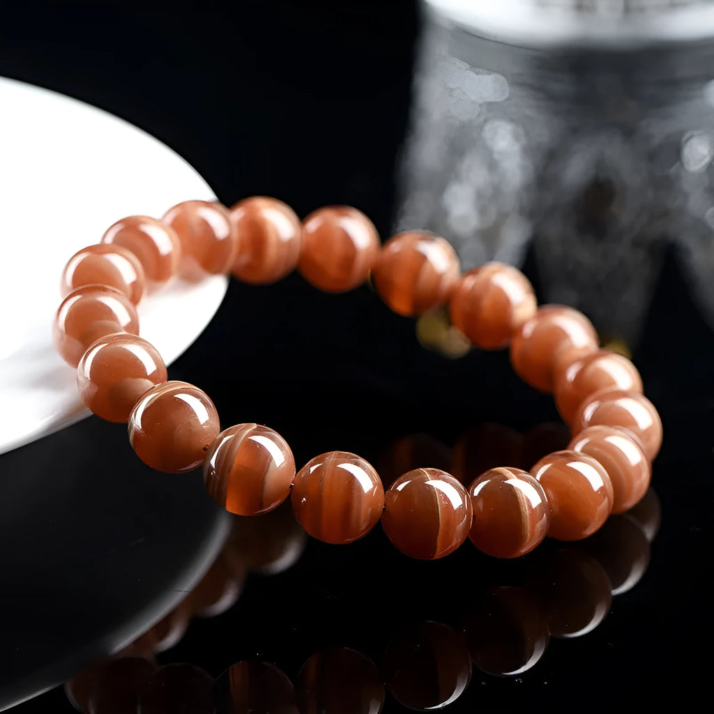 Natural Peruvian rhodochrosite bead bracelet in old mine colour, showing round 8mm beads.