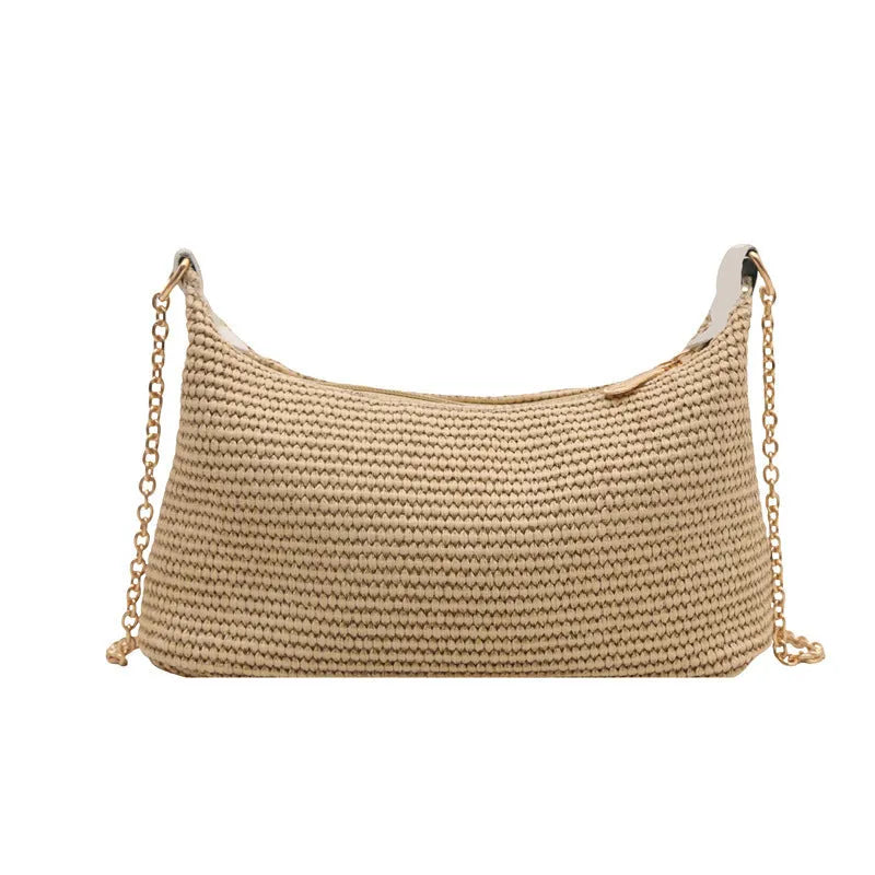 Woven straw beach shoulder tote bag in khaki colour with visible stitching and an outer pocket.
