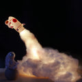 DIY astronaut rocket LED night light kit with battery and USB options, showing model parts and warm glow.