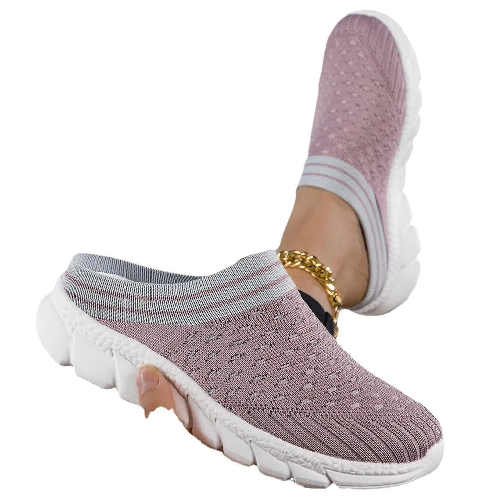 Women's Flyknit slipper shoes in a stripe pattern, showing hollowed-out design and sewing lines, on a viscose sole.