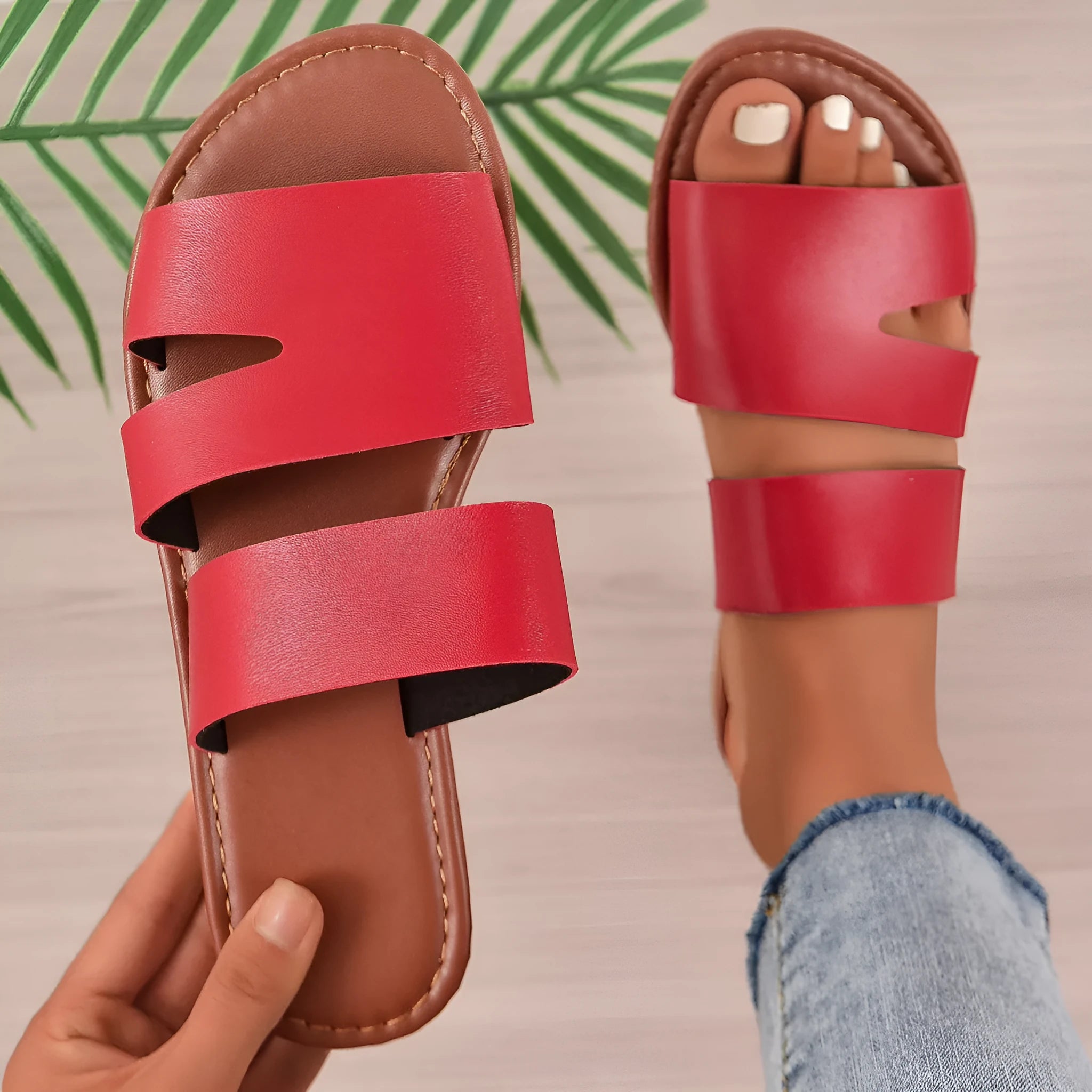Women's white casual flat slippers with one-line design and rubber sole.