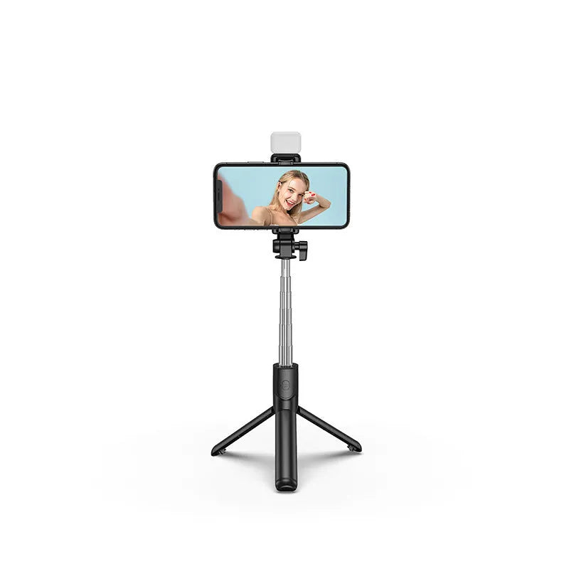 Black aluminium alloy Bluetooth selfie stick with extended tripod legs and a smartphone attached.