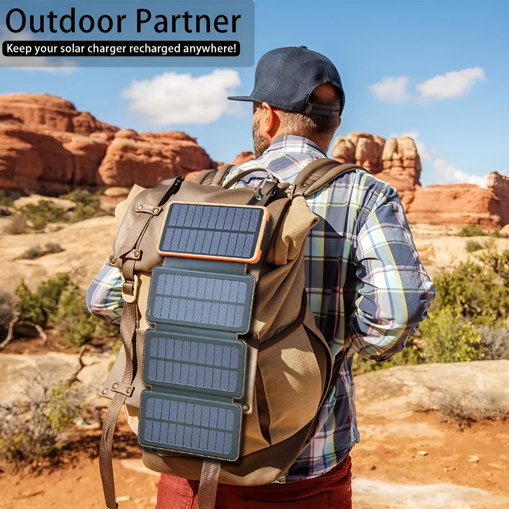 Black outdoor solar power bank with a solar panel, LED light, and soft leather finish, shown with a charging cable.