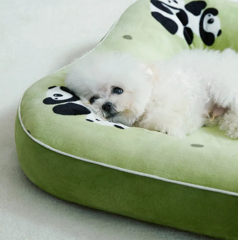 Blue small dog bed cushion with PP cotton fill, size M, on a sofa