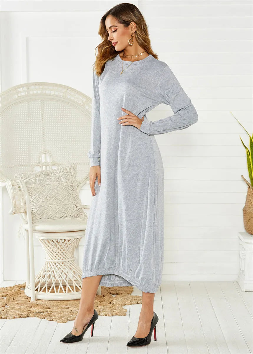 Black lace-up crew neck loose knit lantern dress on a model, showing the lantern silhouette.
