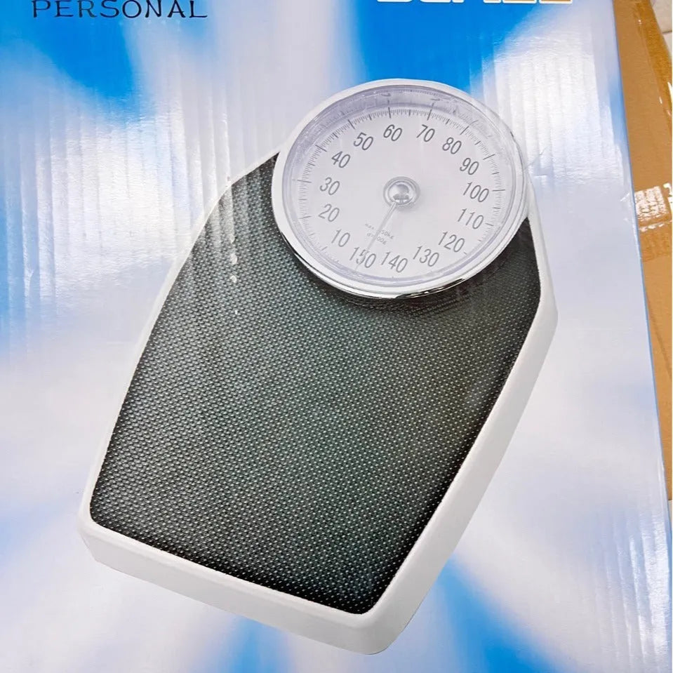 Black mechanical bathroom scale with large dial on a 47x35cm platform.