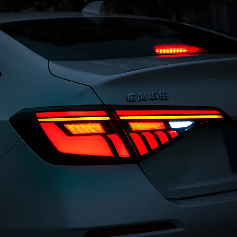 11th generation Honda Civic black and red LED tail light assembly with sequential turn signals