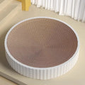 Round green or white cat scratching board nest with replaceable corrugated cardboard centre, 55 cm diameter.